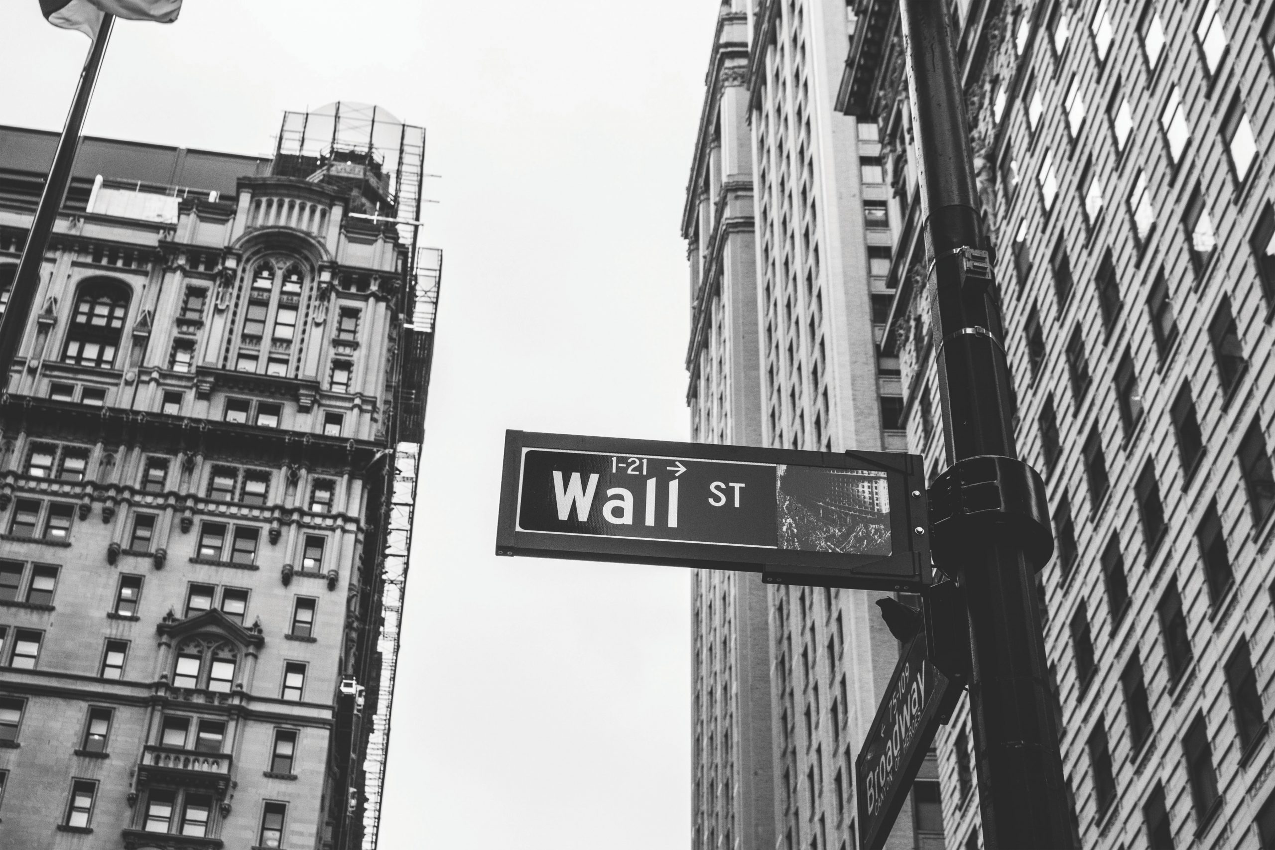 Hedge fund hero image of wall street sign and buildings with black and white filter